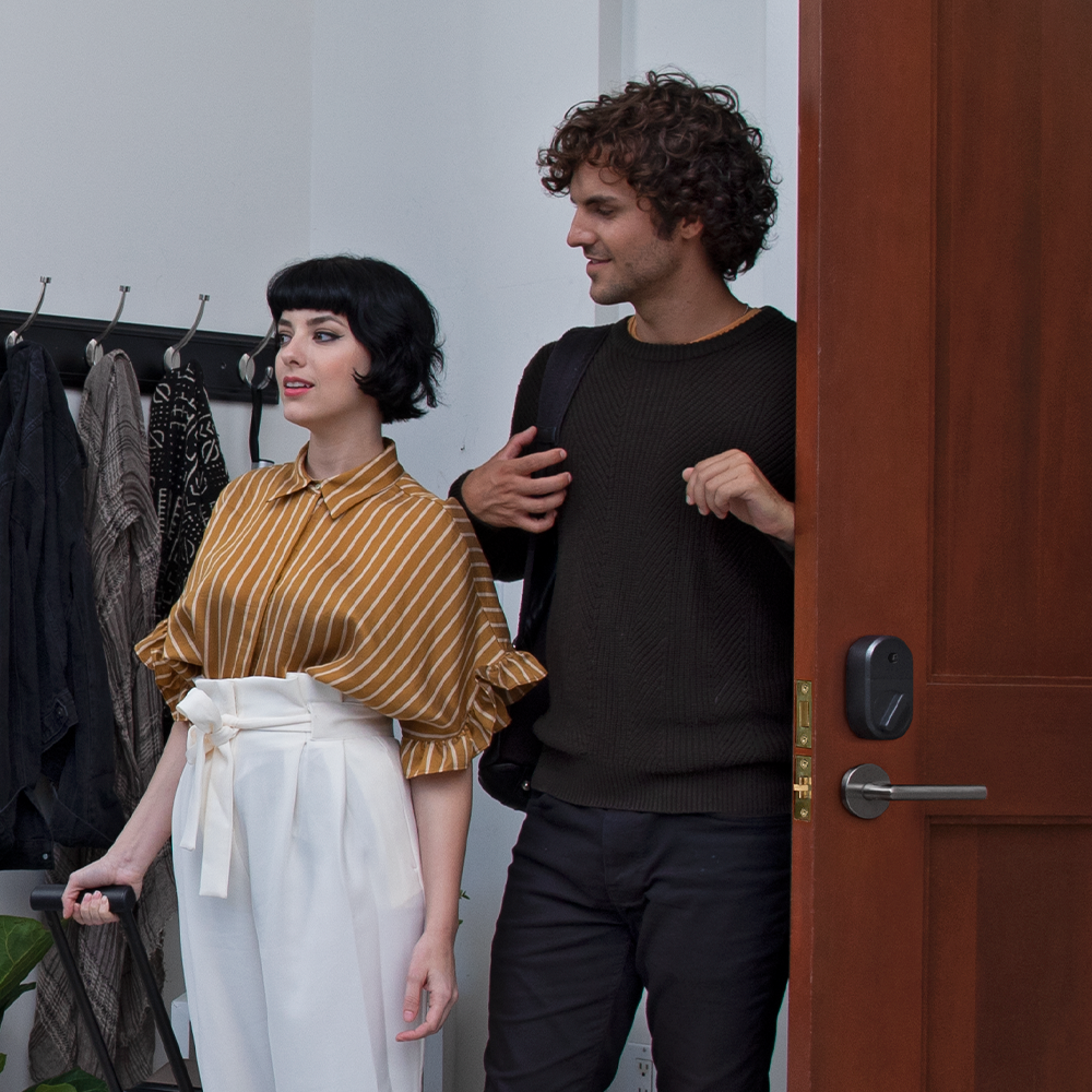 Couple Walking Into House Using Guest Keys