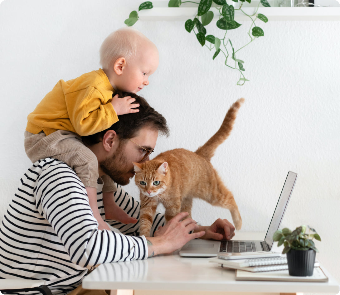 dad with baby and cat at home
