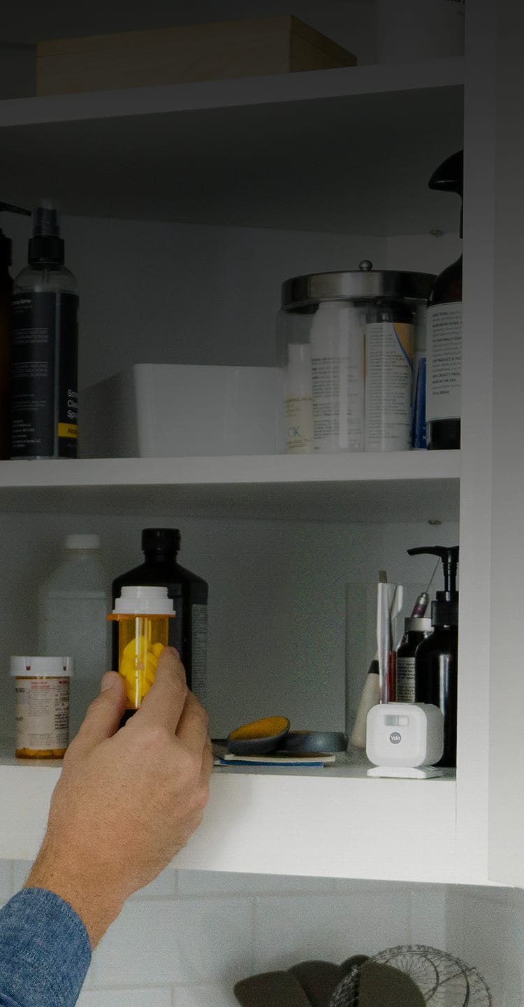 White Yale camera in a medicine cabinet